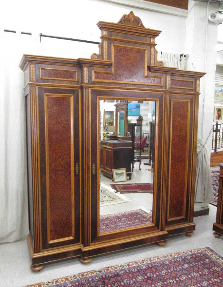 Appraisal: LARGE VICTORIAN THREE-DOOR BREAKFRONT WARDROBE Italian th century black walnut