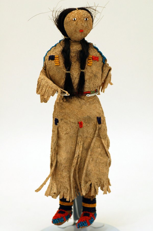 Appraisal: Indian doll of deerskin with overall bead decoration having body