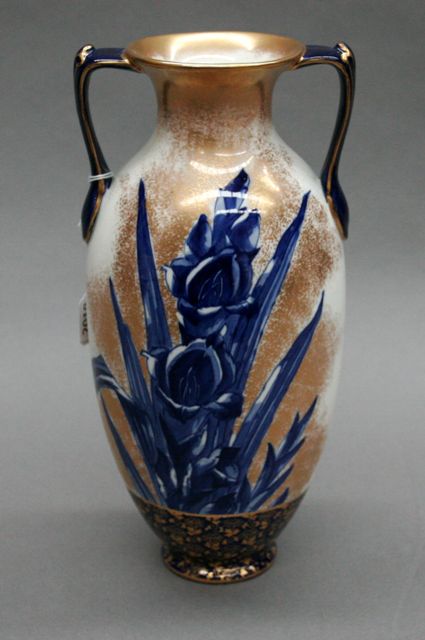 Appraisal: A Royal Doulton twin handled vase painted with blue iris