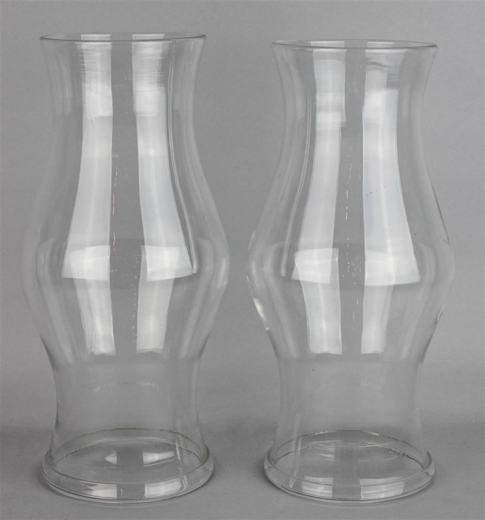 Appraisal: PAIR OF GLASS HURRICANE SHADES of thick glass with molded