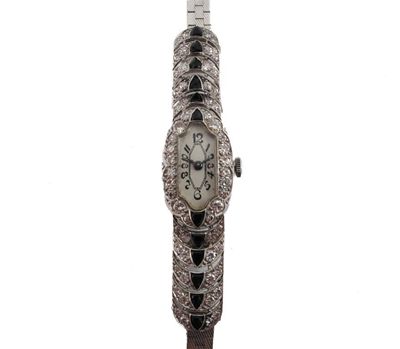 Appraisal: A lady's white gold Art Deco cocktail wristwatch Articulated shoulders