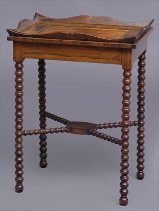 Appraisal: VICTORIAN CARVED ROSEWOOD TRAY-TOP TABLE The scallop-rimmed top centering a