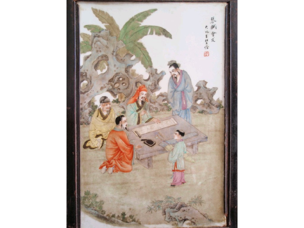 Appraisal: A Chinese porcelain plaque depicting figures reading the Scripture having