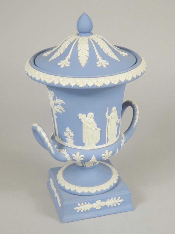 Appraisal: A Wedgwood blue Jasperware two handled campana shaped urn and