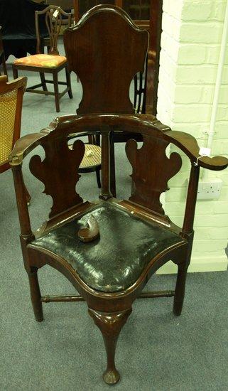 Appraisal: A George I high back corner chair with scrolls to