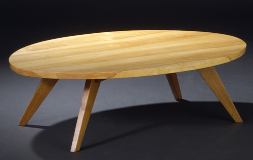 Appraisal: GEORGE NAKASHIMA Early coffee table with an oval birch top