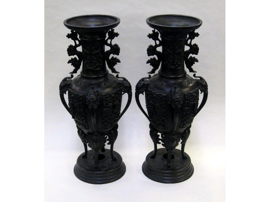 Appraisal: Pair of oriental bronze vases with relief decoration