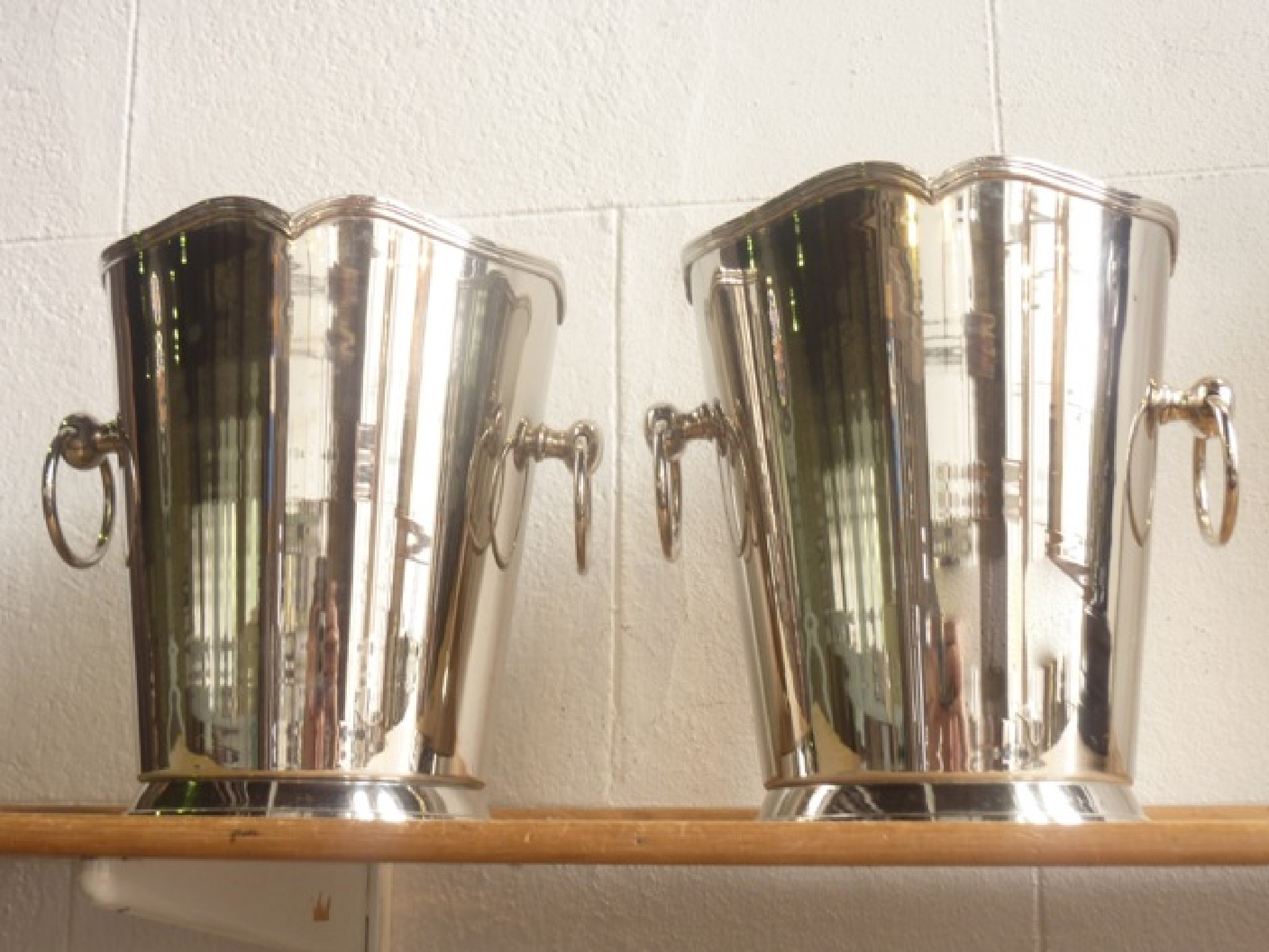 Appraisal: A pair of contemporary electroplated wine coolers of tapering cylindrical