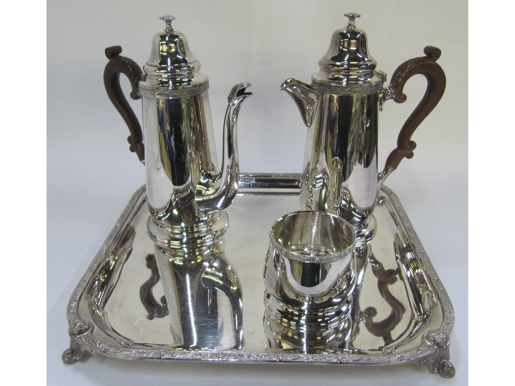 Appraisal: A silver plated three piece cafe au lait set on