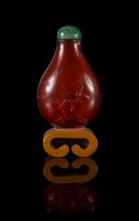 Appraisal: A Carved Amber Snuff Bottle A Carved Amber Snuff Bottle