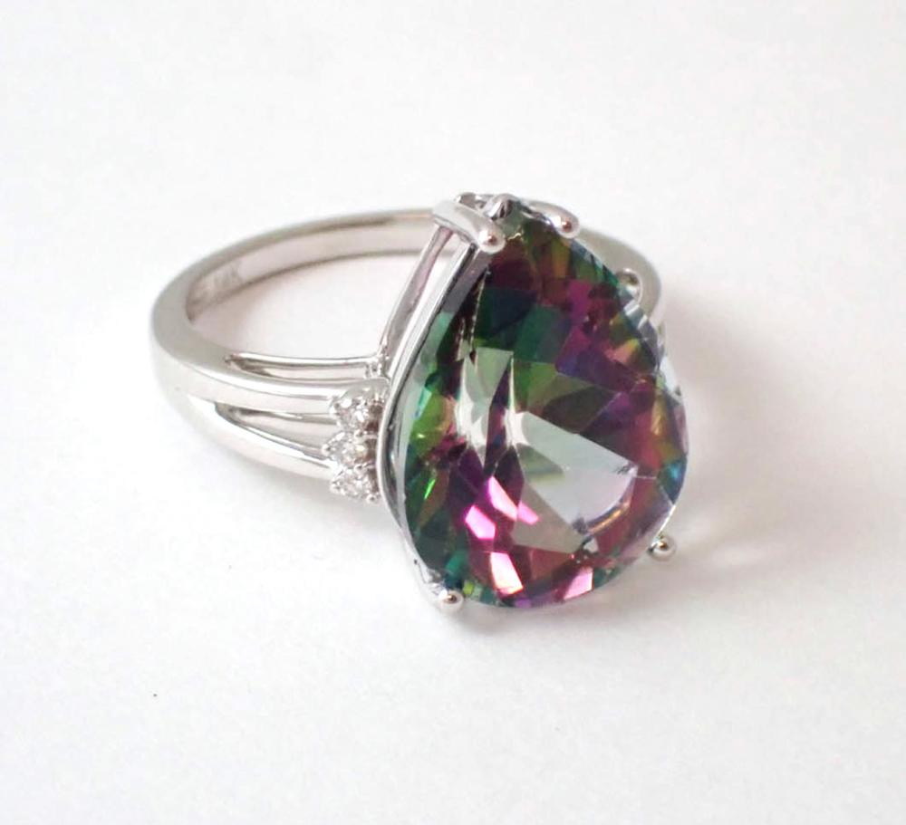 Appraisal: MYSTIC TOPAZ DIAMOND AND FOURTEEN KARAT GOLD RING The k