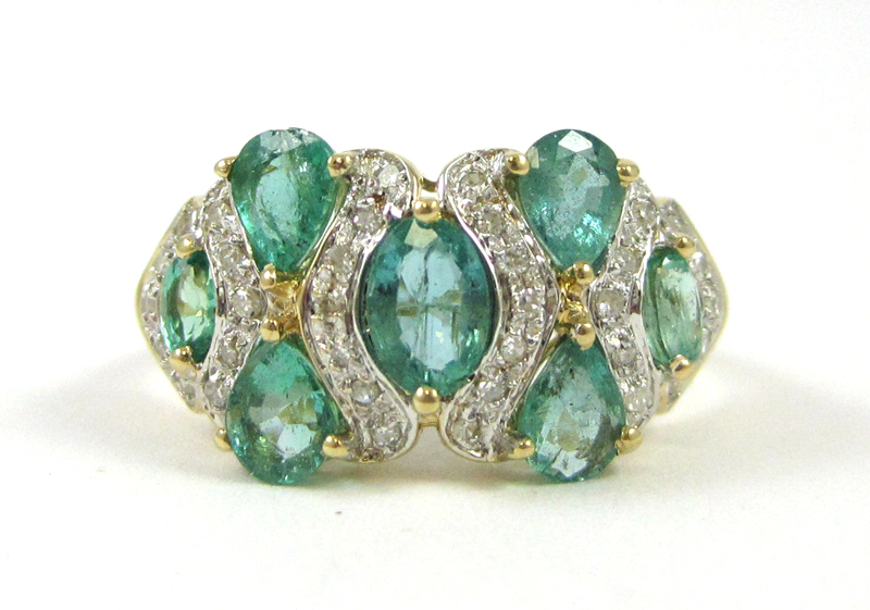 Appraisal: EMERALD DIAMOND AND FOURTEEN KARAT GOLD RING The yellow and