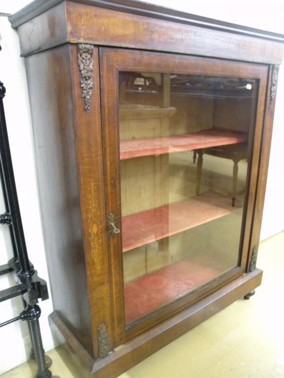 Appraisal: A Victorian walnut and marquetry pier cabinet with gilt metal