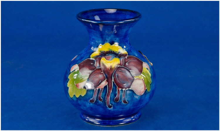 Appraisal: Moorcroft Vase orchid design on blue ground 's inches in