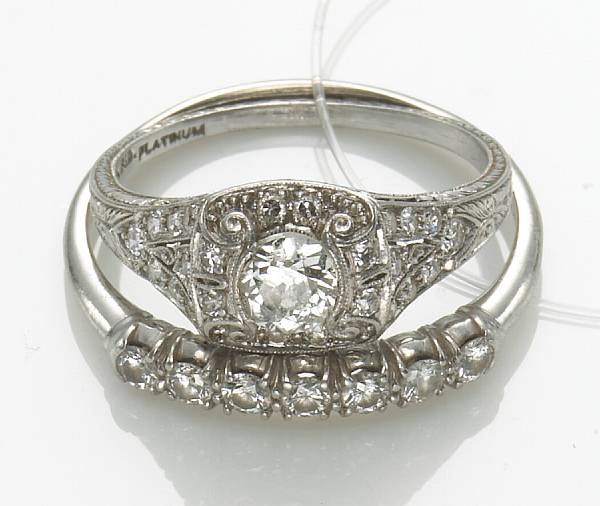 Appraisal: A diamond and platinum ring together with a diamond and