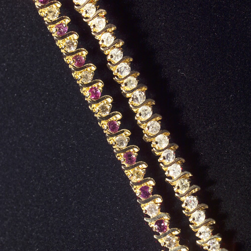 Appraisal: A diamond link bracelet and a ruby and diamond link