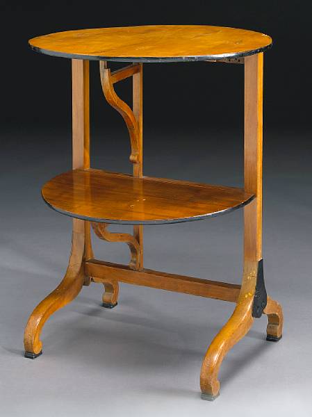 Appraisal: A Biedermeier style walnut two tier folding coaching table th