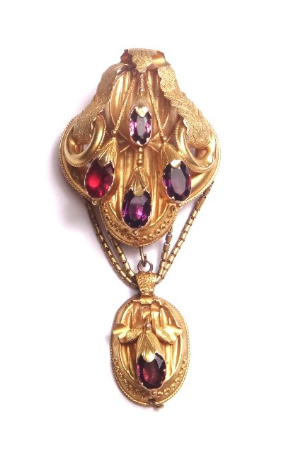 Appraisal: A Victorian gold garnet and red gem set pendant brooch