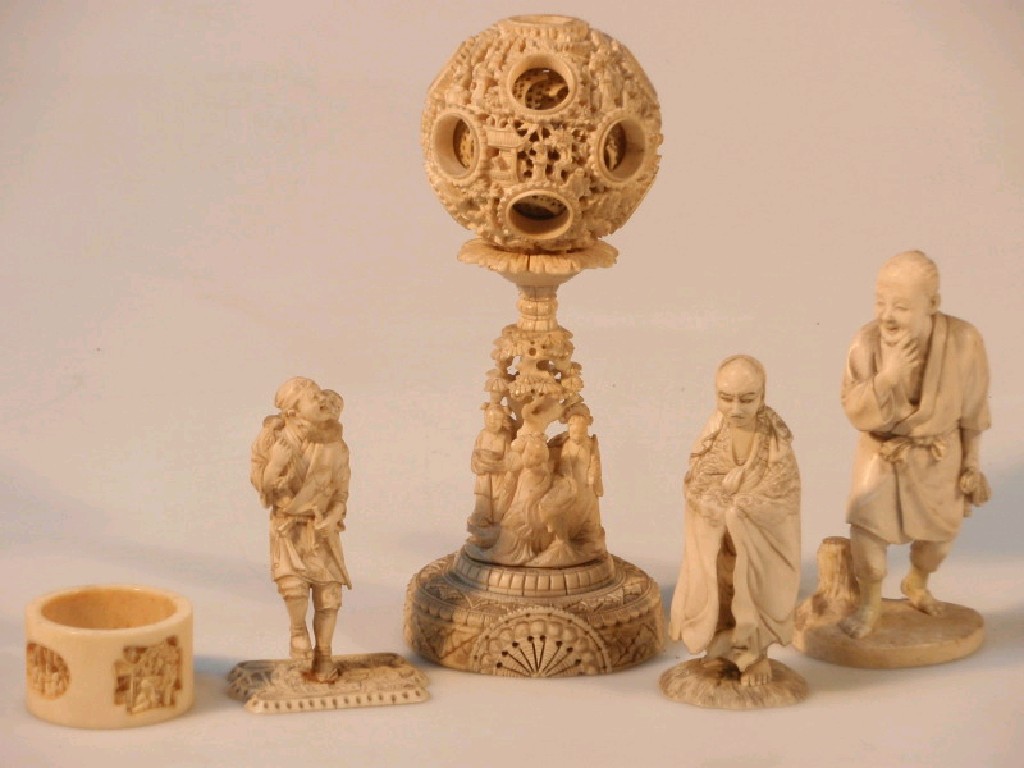 Appraisal: A carved ivory puzzle ball lacking upper section three oriental