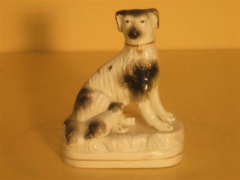 Appraisal: STAFFORDSHIRE DOG AND PUPPY Late th century black and white