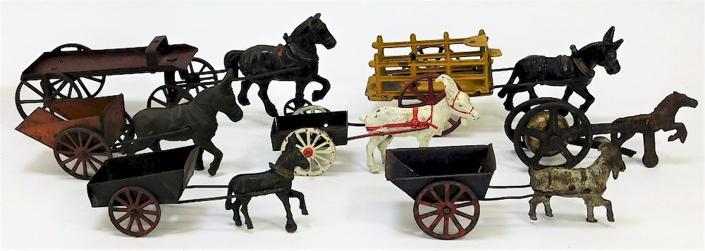 Appraisal: American Cast Iron Animal Drawn Carts Toys United States Early