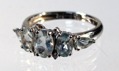 Appraisal: A five stone dress ring with blue stones a pierced