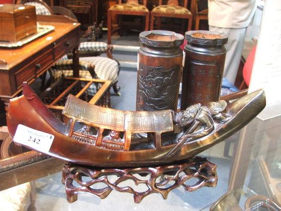 Appraisal: A CHINESE CARVED HORN BOAT with wooden stand together with