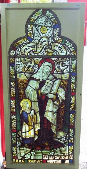 Appraisal: A stained glass arched panel of St Anne mother of