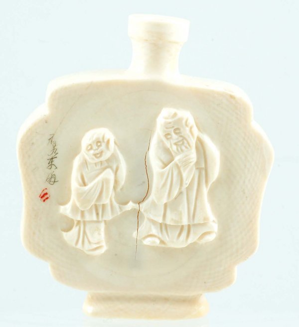 Appraisal: A Chinese carved ivory snuff bottle Square in shape with