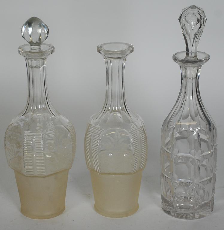 Appraisal: THREE CUT GLASS DECANTERS including pair with wheel cut floral