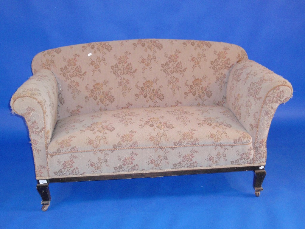 Appraisal: An Edwardian drop arm two-seater sofa