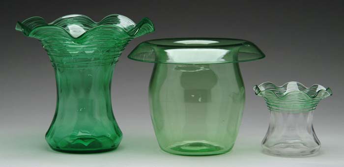 Appraisal: THREE ART GLASS ITEMS Green crystal vase with applied green