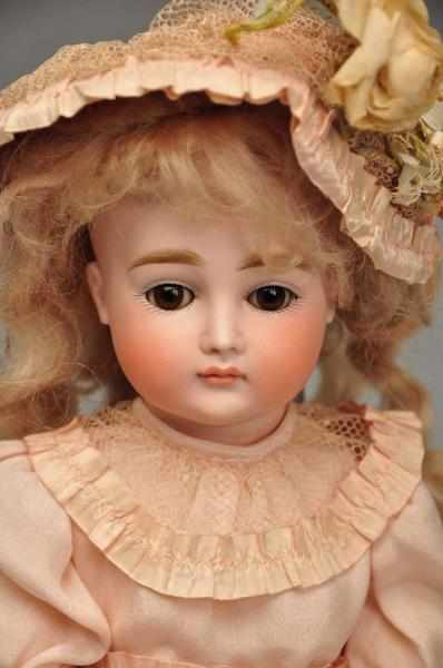 Appraisal: German Bisque Child Doll Description Unmarked early pouty bisque socket