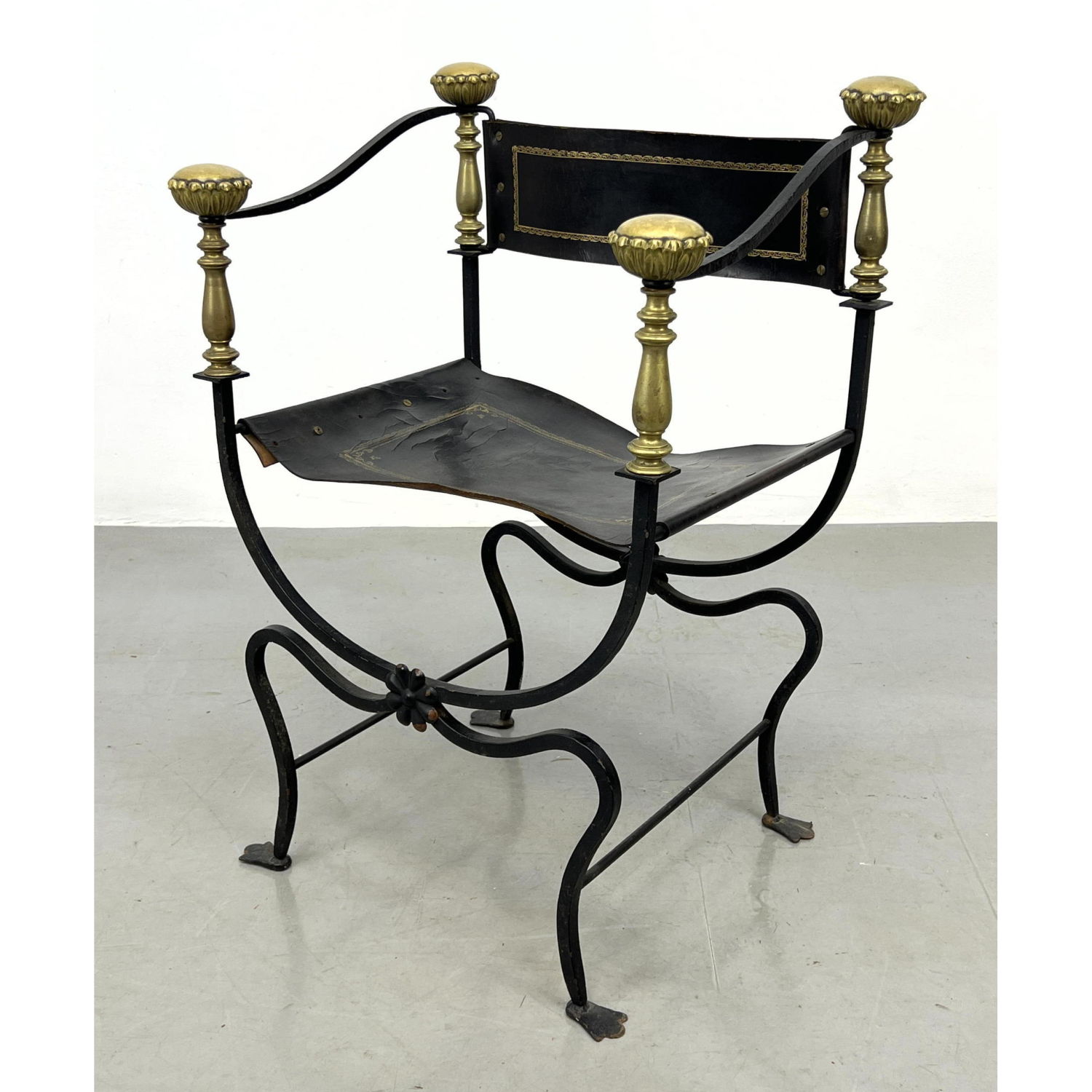 Appraisal: Savronarola Iron Brass and Leather Armchair Campaign style Dimensions H