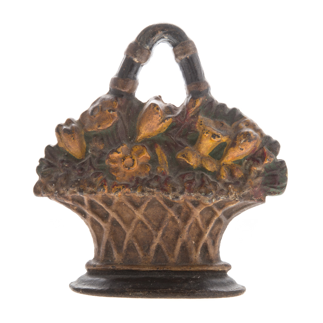 Appraisal: Painted cast iron flowers in basket doorstop in H Condition