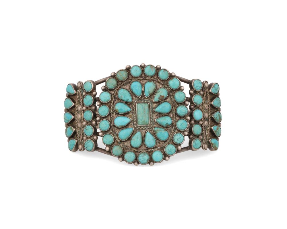 Appraisal: A Zuni-style silver and turquoise cluster set cuff bracelet Mid-