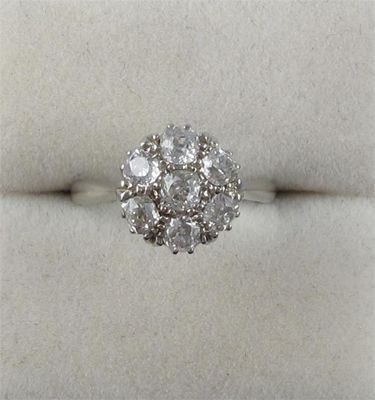 Appraisal: A diamond cluster ring set with seven circular cut diamonds