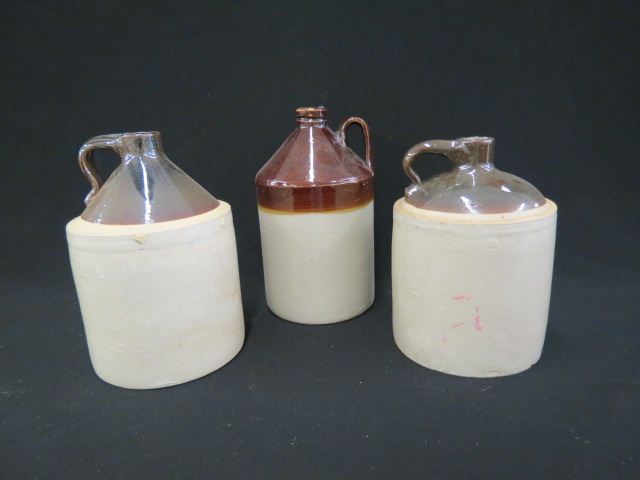 Appraisal: Stoneware Jugs brown white to