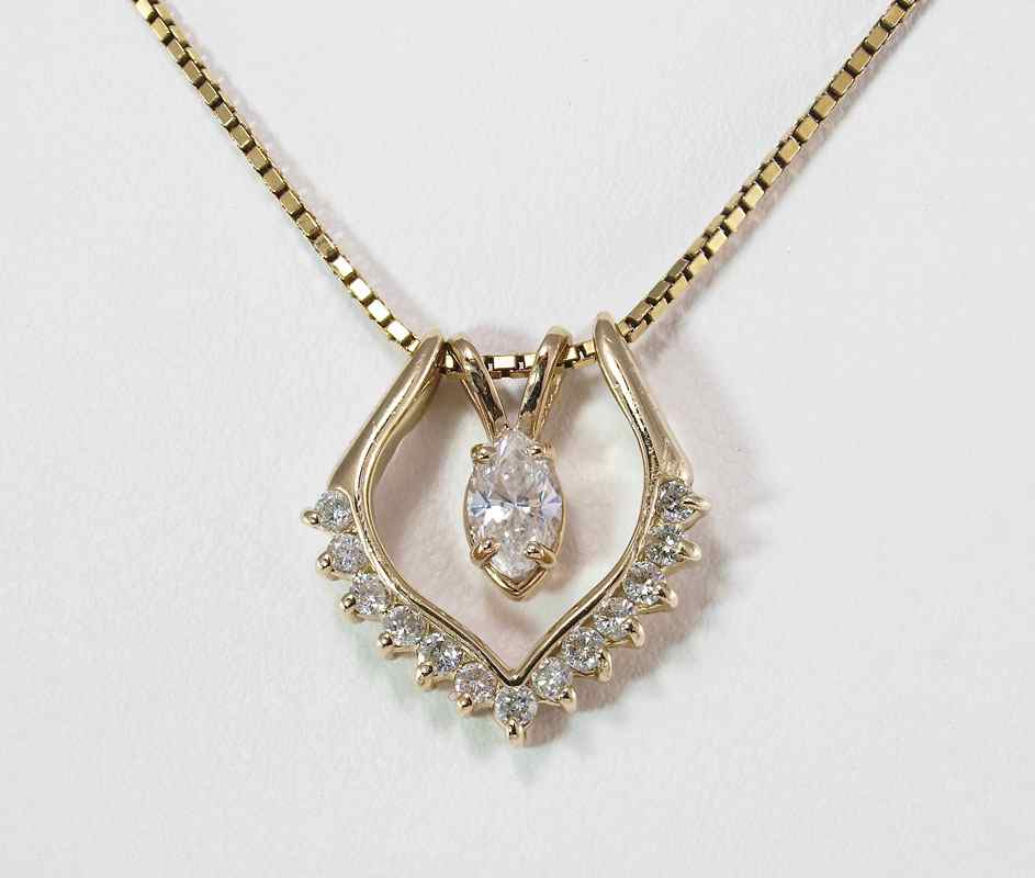 Appraisal: CT DIAMOND PENDANT NECKLACE K yellow gold necklace contains one