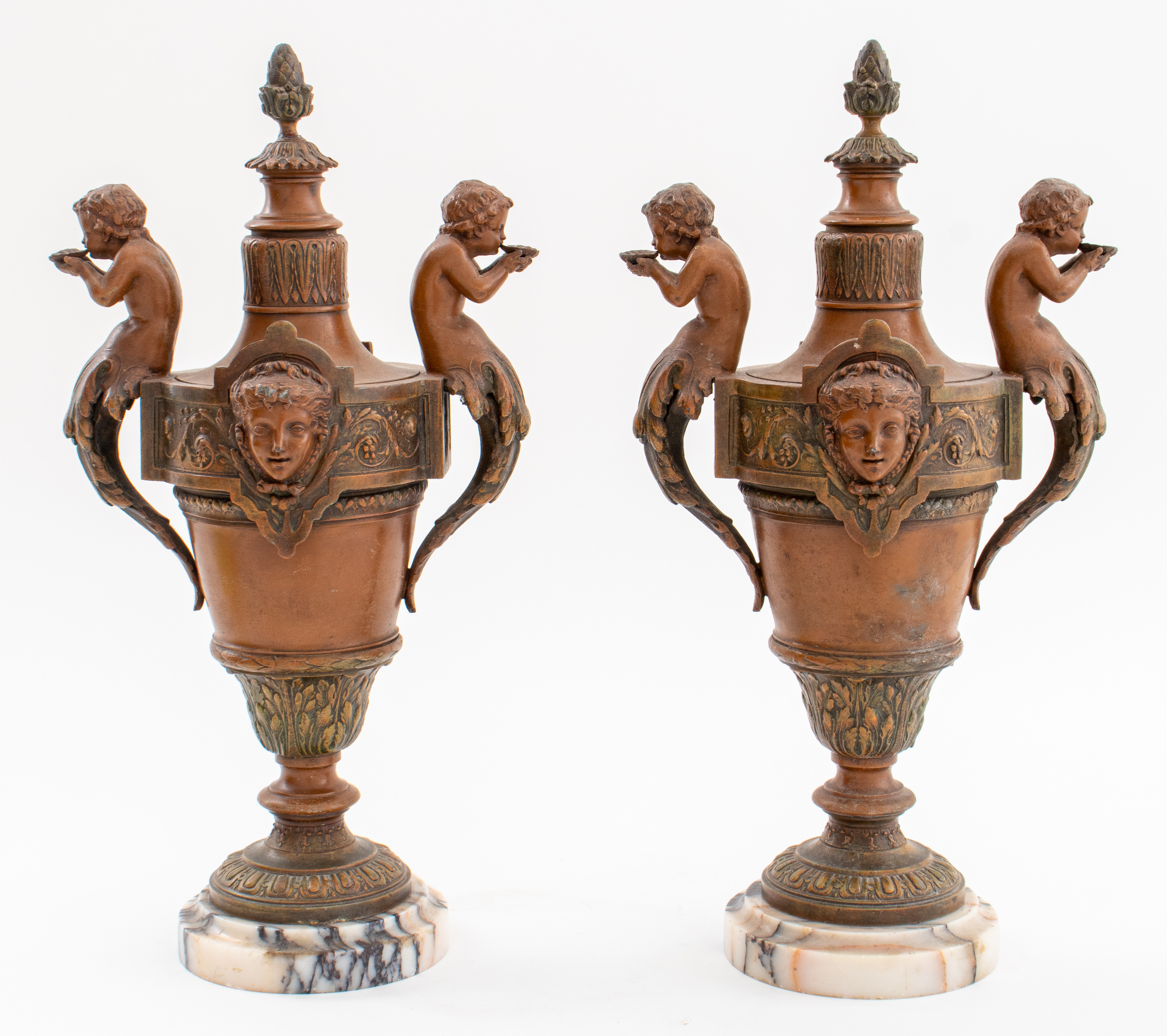 Appraisal: RENAISSANCE REVIVAL COLD-PAINTED METAL URNS PAIR Pair of Renaissance Revival