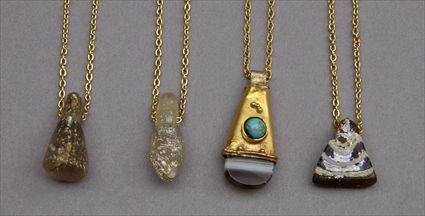 Appraisal: Three Pendants on Gold Chains together with Agate and Gold