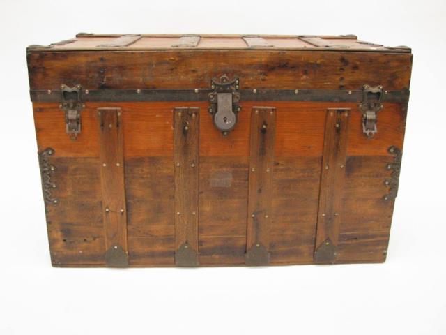 Appraisal: An antique wooden sea trunk restored wood and metal banding