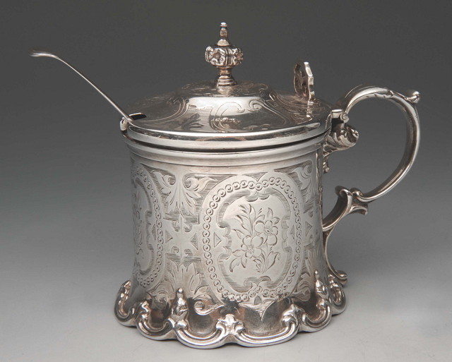 Appraisal: A VICTORIAN SILVER MUSTARD POT with floral knop shaped lid