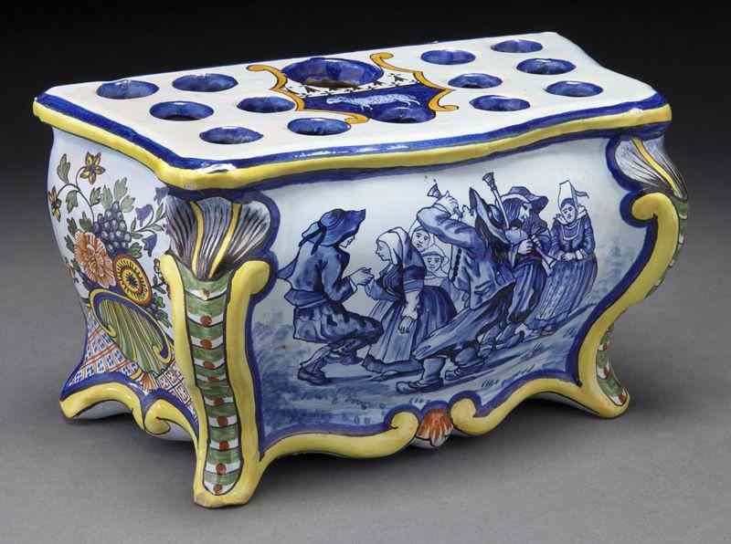 Appraisal: Porquier-Beau Quimper flower potin the shape of a chest the