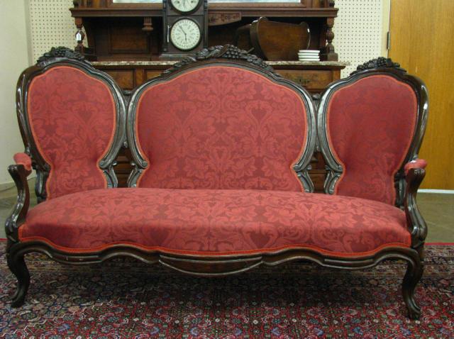 Appraisal: Victorian carved sofa walnut frame with three section upholstered back