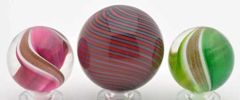 Appraisal: Lot of Mark Matthews Contemporary Marbles Description The two smaller