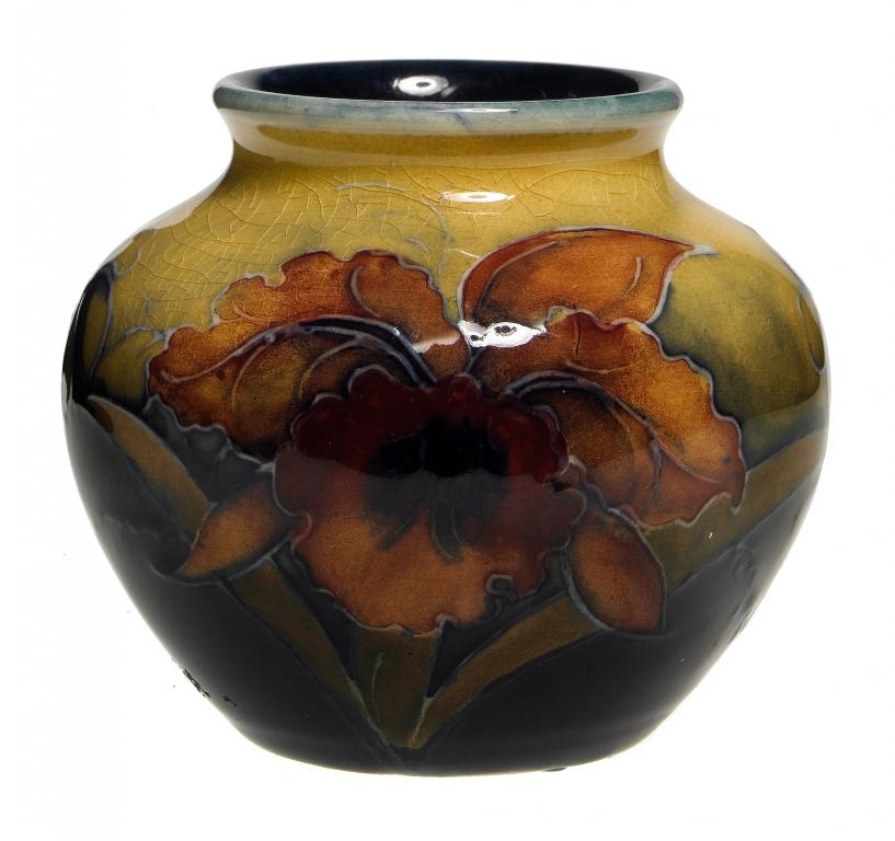 Appraisal: A MOORCROFT MINIATURE ORCHID VASE DESIGNED BY WILLIAM MOORCROFT cm