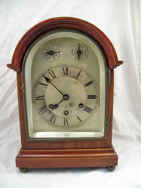 Appraisal: Mahogany Round Top Shelf Clock Mahogany case clock with a