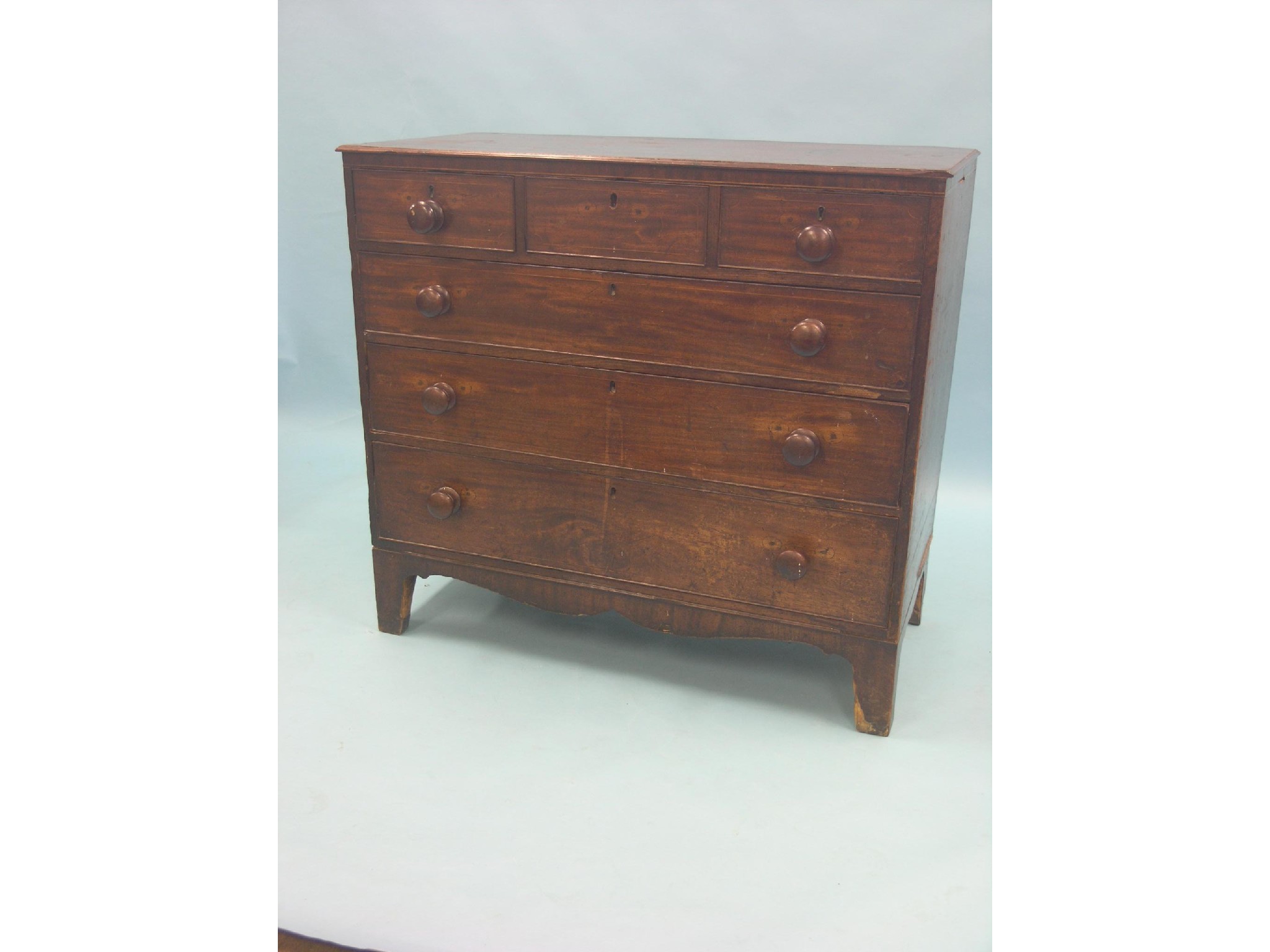 Appraisal: An early th century inlaid mahogany chest three short and