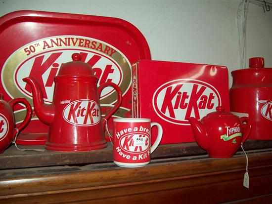 Appraisal: A COLLECTION OF EIGHT ITEMS INCLUDING ENAMEL KIT-KAT TEAPOTS MUGS